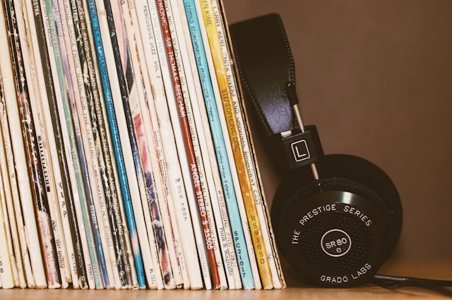 vinyls next to headphones